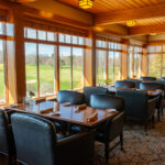 Photo of dining area overlooking the golf course at West Bend Country Club