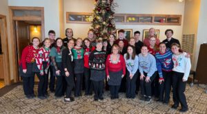 West Bend Country Club staff in holiday themed outfits.