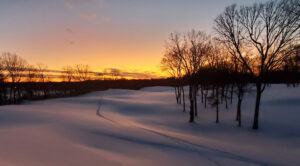 sun set on a winter golf course.